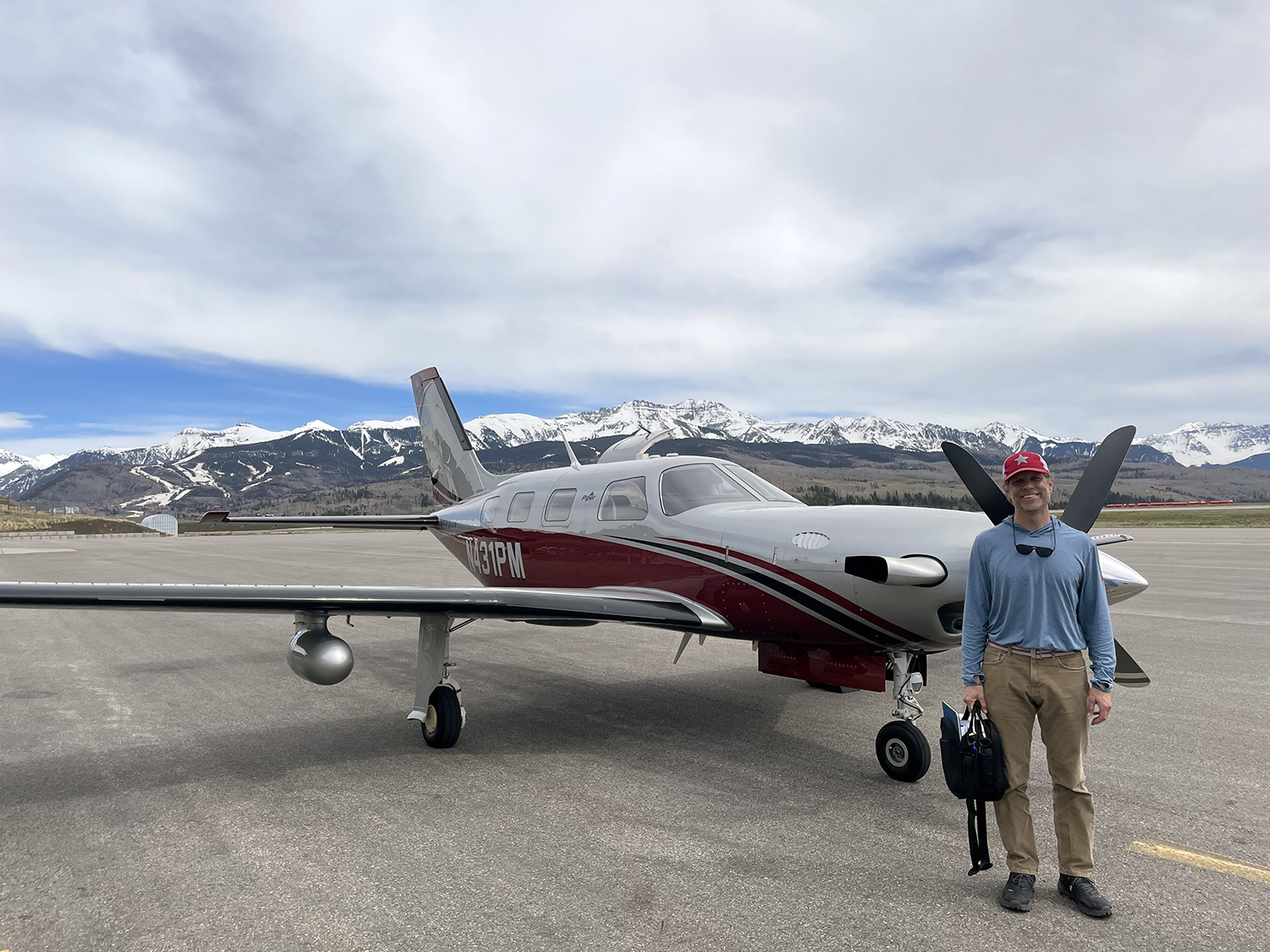 Pilot Brian Minnehan in front of his Piper Meridian after completing his Initial Aircraft training. On the ramp at Telluride (KTEX) where he lives with his family.